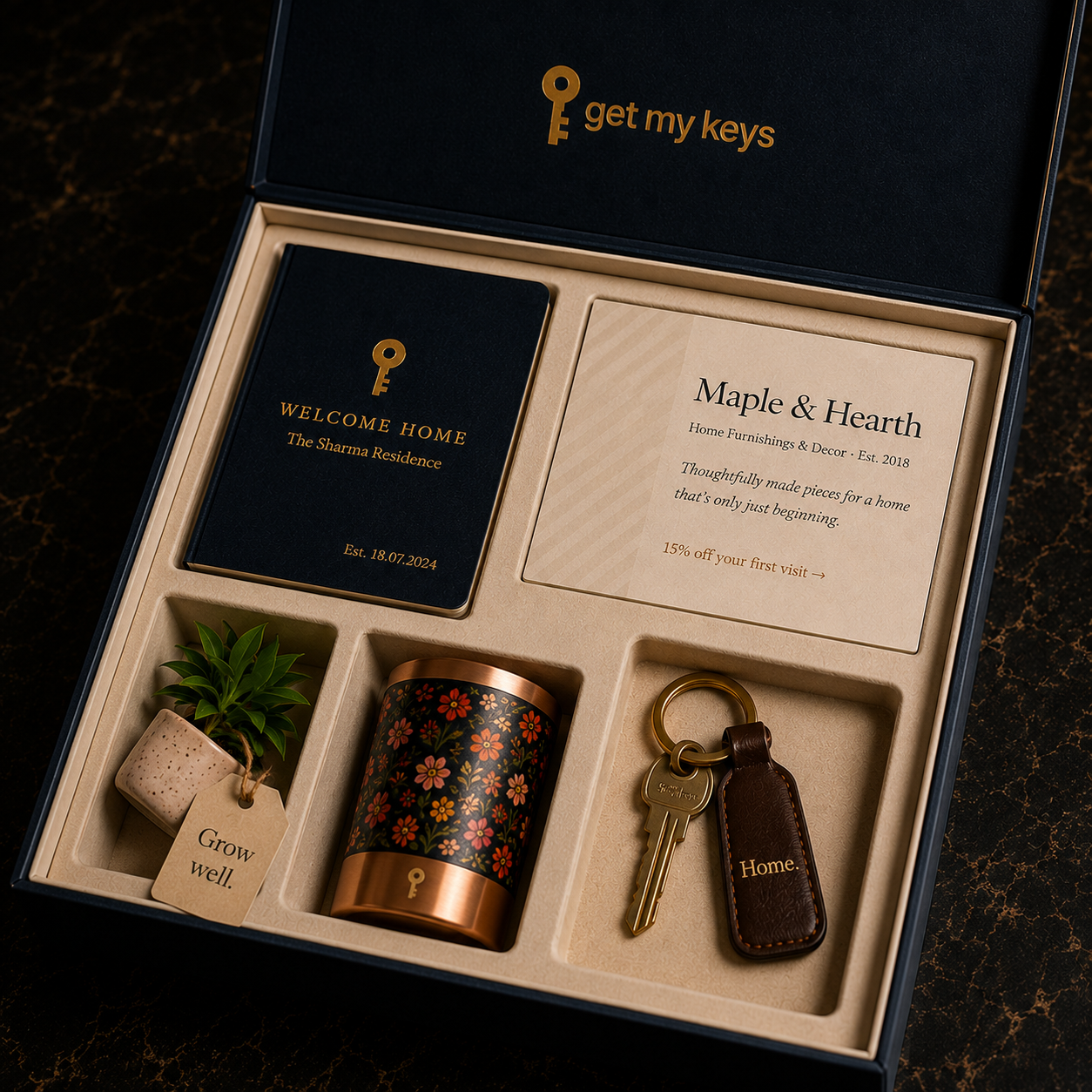 The GetMyKeys possession-day kit, open, showing the welcome book, vendor card, key tag, and gifts